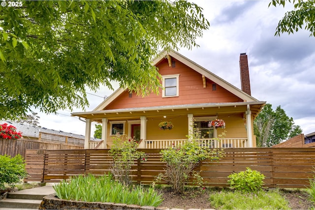 8113 SE Morrison St, Portland, OR 97215 - view of front of home featuring a porch and a chimney