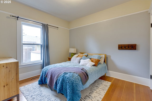8113 SE Morrison St, Portland, OR 97215 - bedroom featuring baseboards and wood finished floors