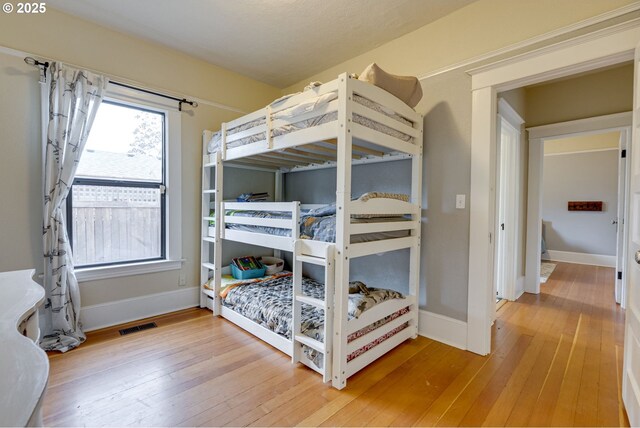 8113 SE Morrison St, Portland, OR 97215 - bedroom featuring hardwood / wood-style flooring and baseboards