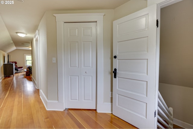 8113 SE Morrison St, Portland, OR 97215 - hallway with light wood-style floors, vaulted ceiling, and baseboards