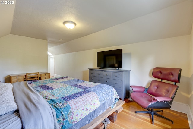 8113 SE Morrison St, Portland, OR 97215 - bedroom featuring vaulted ceiling and light wood-type flooring