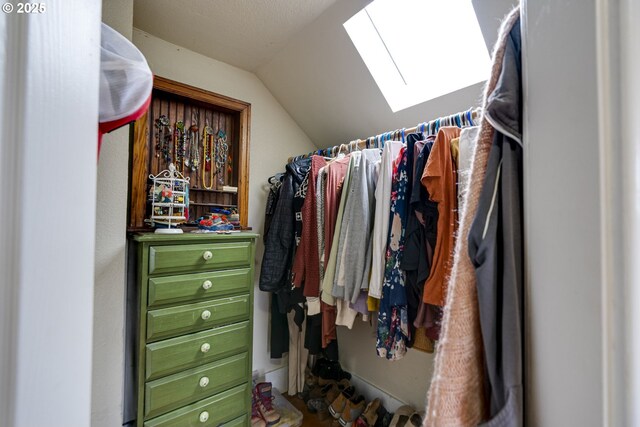 8113 SE Morrison St, Portland, OR 97215 - walk in closet featuring vaulted ceiling and a skylight