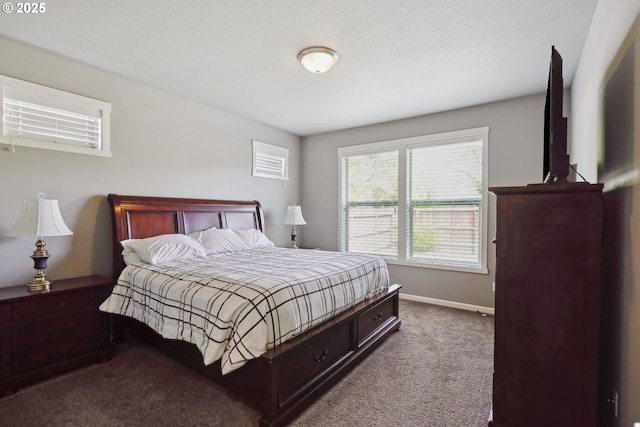 bedroom with baseboards and carpet