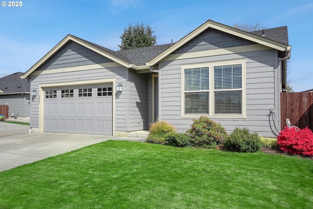 single story home featuring driveway, roof with shingles, a front yard, a garage, and fence
