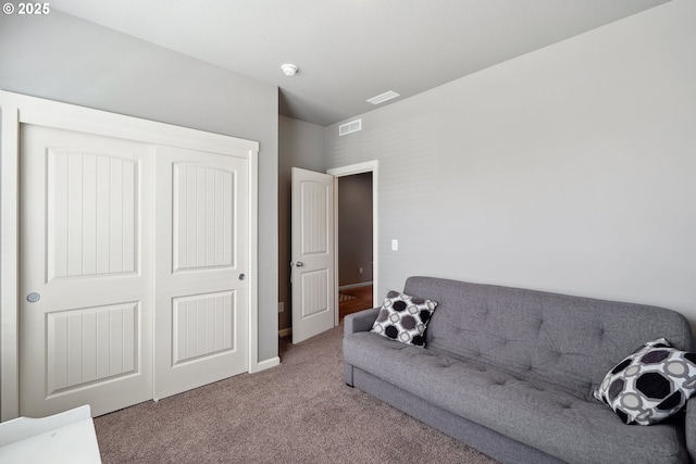living area featuring baseboards, carpet, and visible vents