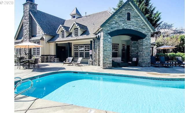 view of pool featuring a patio area