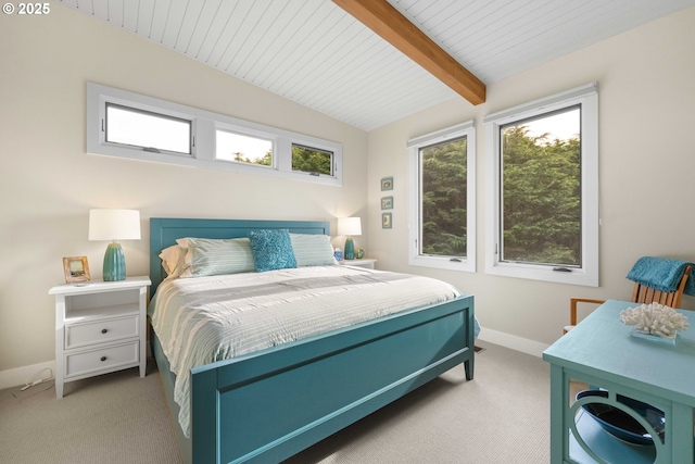 carpeted bedroom with wooden ceiling and vaulted ceiling with beams