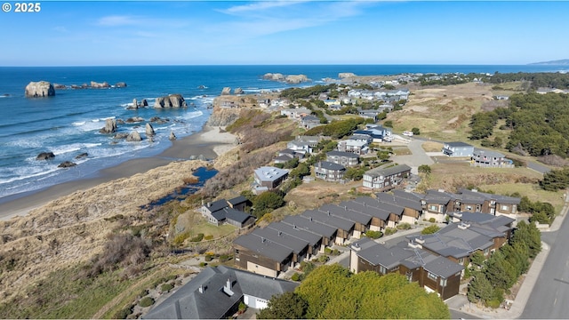 bird's eye view featuring a water view and a view of the beach