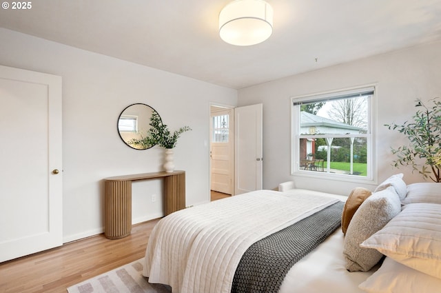 bedroom with light wood finished floors