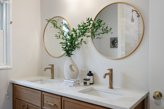 full bath featuring double vanity and a sink