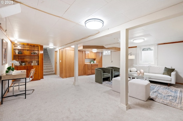 living room with light carpet, stairs, and a wealth of natural light