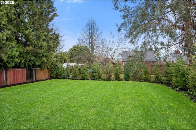 view of yard featuring fence