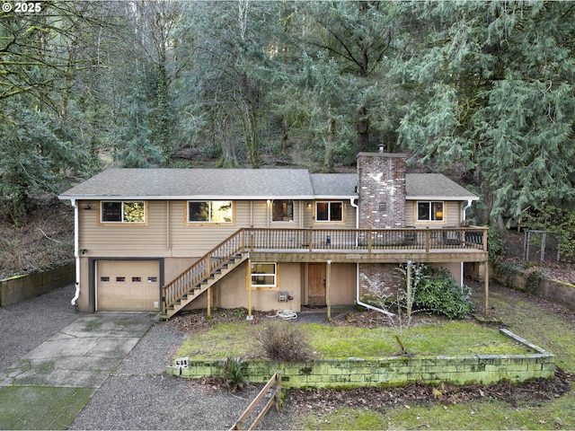 view of front facade with a deck and a garage