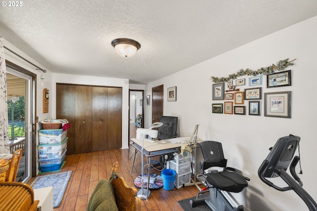 office featuring hardwood / wood-style flooring and a textured ceiling