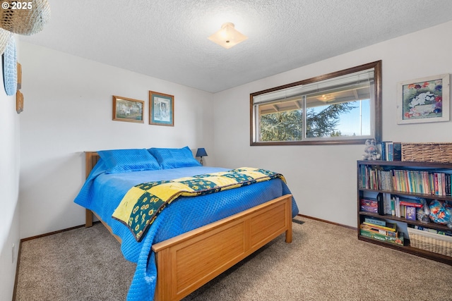 carpeted bedroom with a textured ceiling