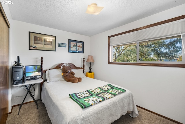 bedroom featuring carpet, a textured ceiling, and a closet