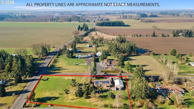 birds eye view of property featuring a rural view