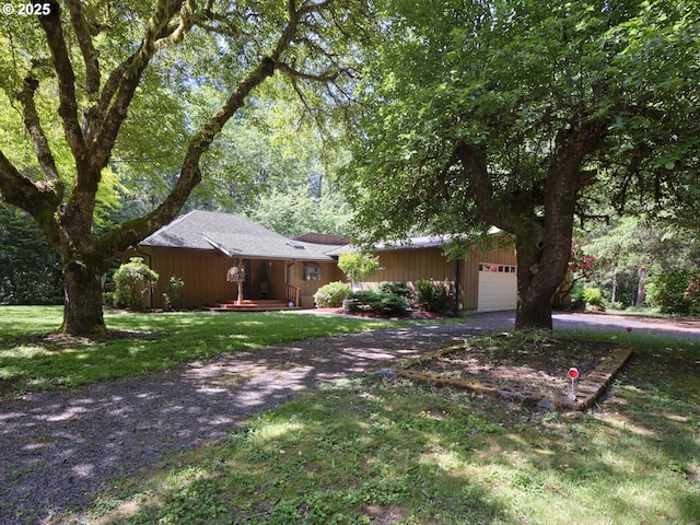 205 Baker Rd, Ariel, WA 98603 - ranch-style house featuring driveway, a garage, and a front lawn