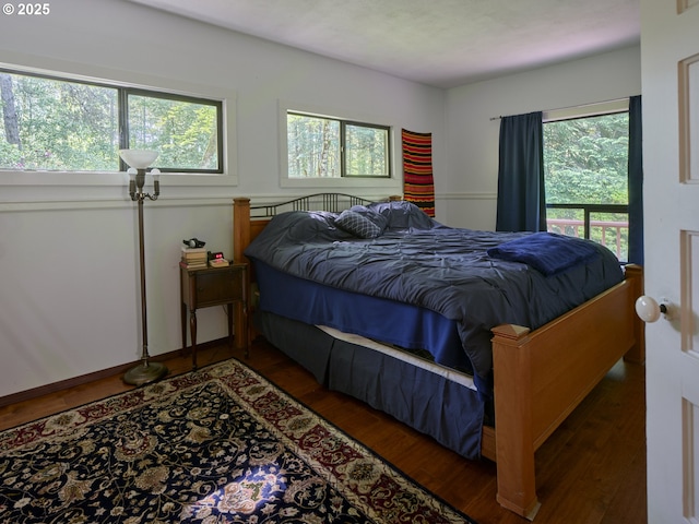 205 Baker Rd, Ariel, WA 98603 - bedroom with wood finished floors and multiple windows