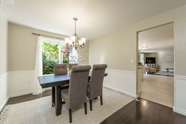 2614 NE 176th Ave, Vancouver, WA 98684 - dining area with a chandelier, light wood finished floors, and baseboards