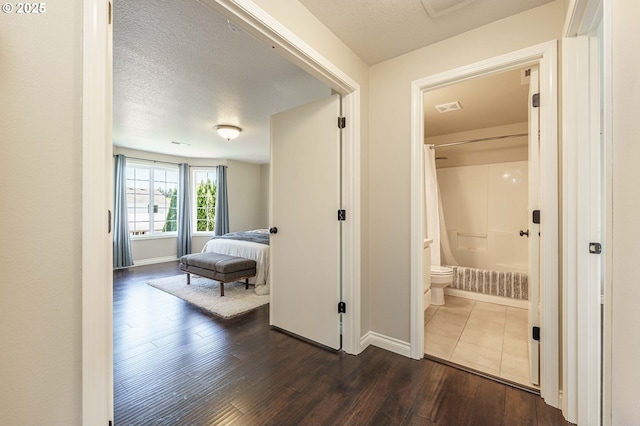 2614 NE 176th Ave, Vancouver, WA 98684 - hallway with dark wood finished floors, baseboards, and a textured ceiling