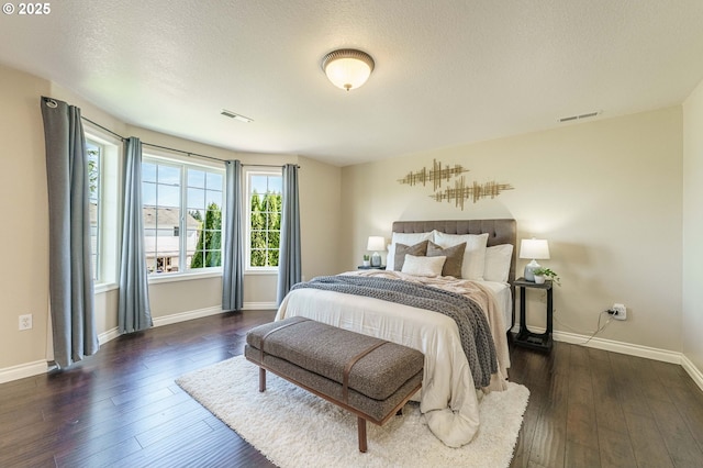 2614 NE 176th Ave, Vancouver, WA 98684 - bedroom with baseboards, dark wood-type flooring, and a textured ceiling