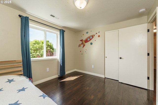2614 NE 176th Ave, Vancouver, WA 98684 - unfurnished bedroom featuring dark wood-style flooring, baseboards, and a closet