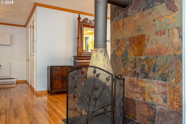10001 SW 35th Ave, Portland, OR 97219 - detailed view of ornamental molding, wood finished floors, a baseboard radiator, and a wood stove