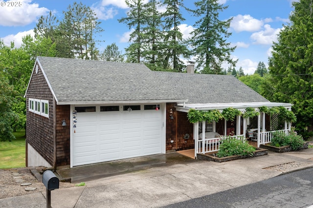 10001 SW 35th Ave, Portland, OR 97219 - view of front facade featuring covered porch, roof with shingles, a chimney, a garage, and driveway