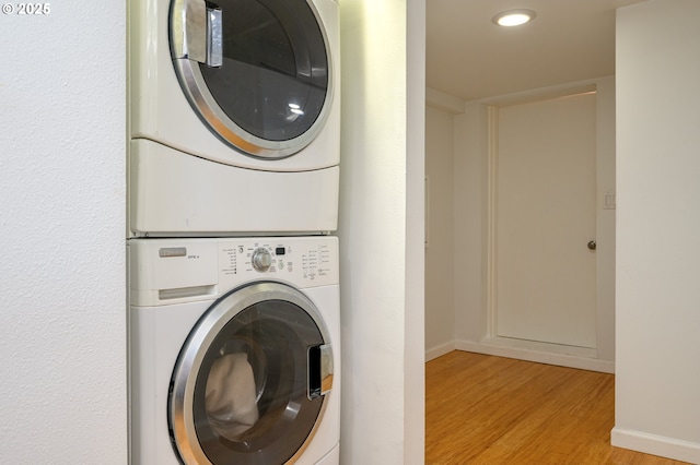 10001 SW 35th Ave, Portland, OR 97219 - laundry area with stacked washer / dryer, light wood-style floors, and recessed lighting