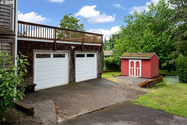 10001 SW 35th Ave, Portland, OR 97219 - garage featuring a storage unit and driveway