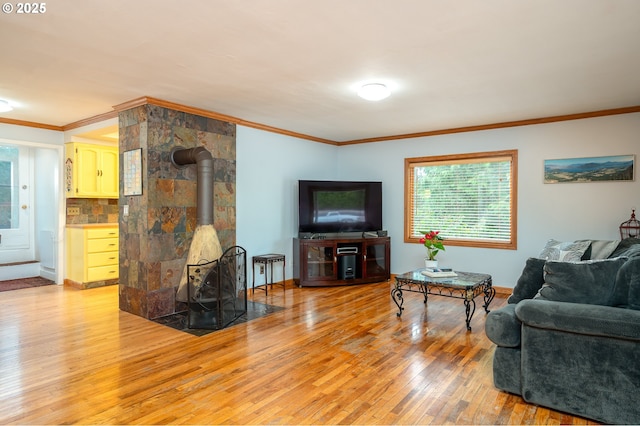 10001 SW 35th Ave, Portland, OR 97219 - living area with a wood stove, light wood-type flooring, healthy amount of natural light, and crown molding