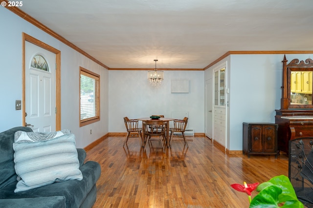 10001 SW 35th Ave, Portland, OR 97219 - dining space featuring hardwood / wood-style floors, ornamental molding, a chandelier, and baseboard heating
