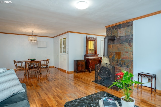 10001 SW 35th Ave, Portland, OR 97219 - living area with wood-type flooring, ornamental molding, and a wood stove
