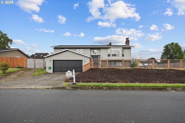 3780 SE 21st Dr, Gresham, OR 97080 - view of front of property with a chimney, asphalt driveway, fence, and a garage
