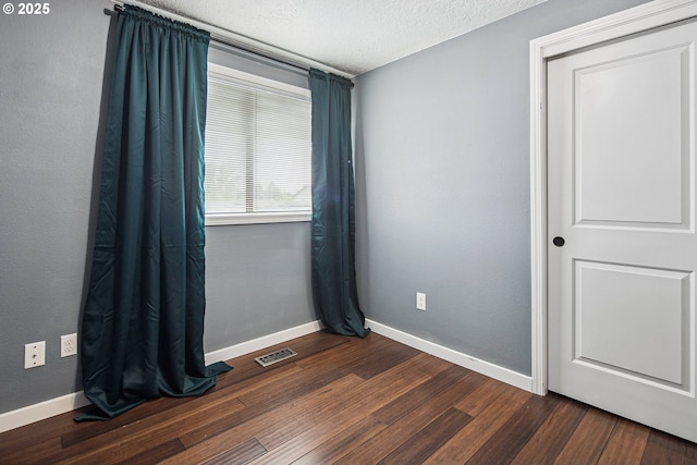 3780 SE 21st Dr, Gresham, OR 97080 - empty room with baseboards, dark wood-type flooring, and a textured ceiling