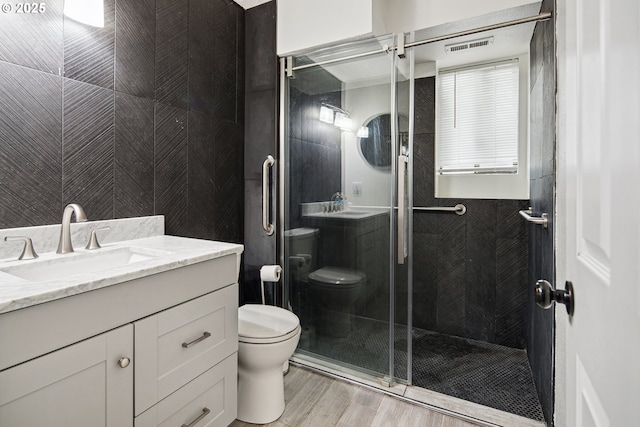 3780 SE 21st Dr, Gresham, OR 97080 - bathroom with toilet, a shower stall, vanity, and wood finished floors