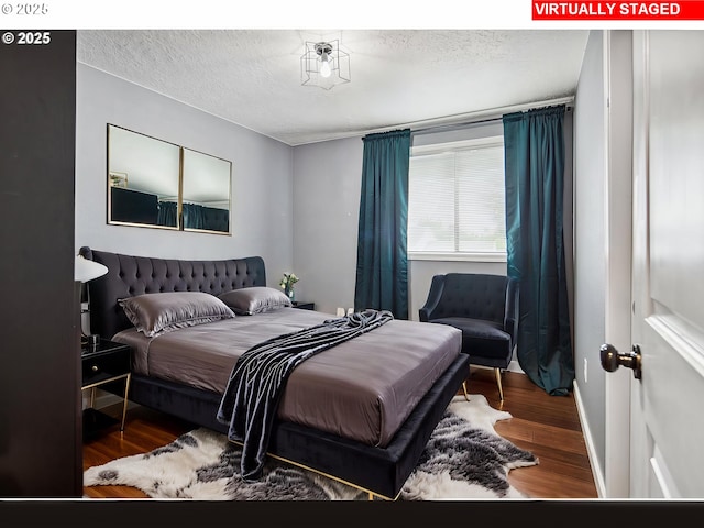 3780 SE 21st Dr, Gresham, OR 97080 - bedroom featuring a textured ceiling and wood finished floors
