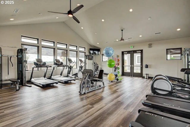 exercise room featuring hardwood / wood-style flooring, vaulted ceiling, french doors, and ceiling fan