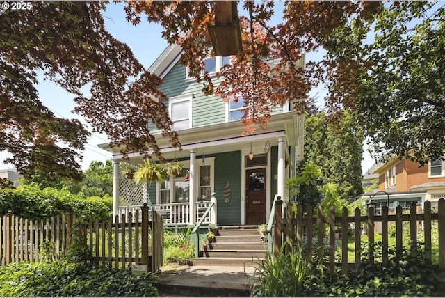 23 NE 17th Ave, Portland, OR 97232 - view of front of home featuring covered porch and a fenced front yard
