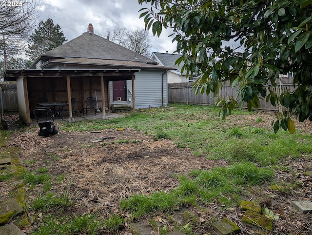 view of yard with a patio and a fenced backyard