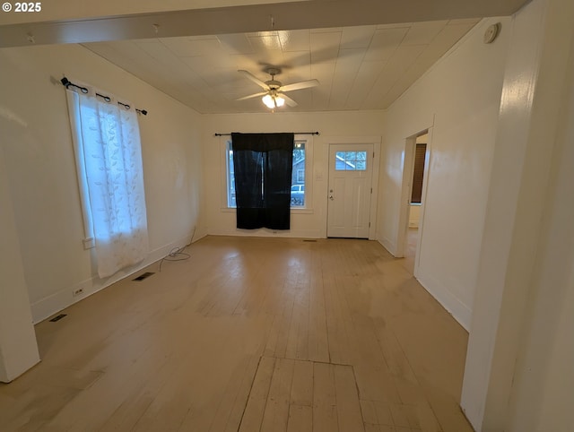 foyer with ceiling fan, light wood-style flooring, visible vents, and a healthy amount of sunlight