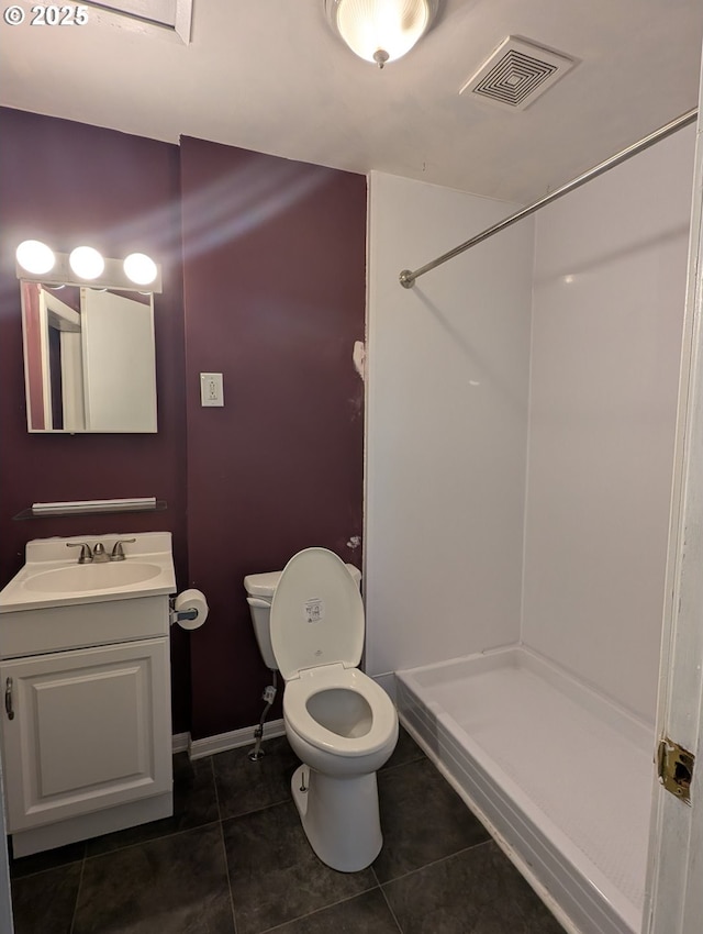 bathroom featuring tile patterned flooring, toilet, vanity, visible vents, and a shower