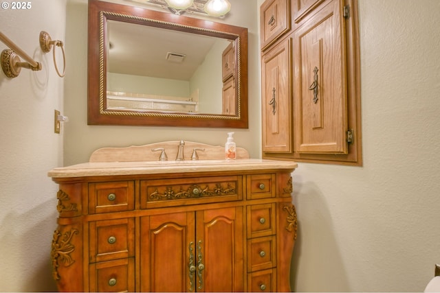 bathroom featuring visible vents and vanity