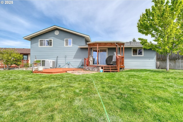back of house featuring a lawn, fence, a wooden deck, and central air condition unit