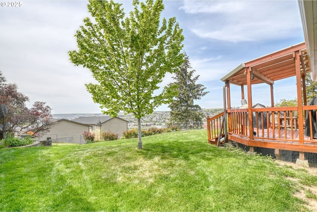 view of yard featuring a deck and fence
