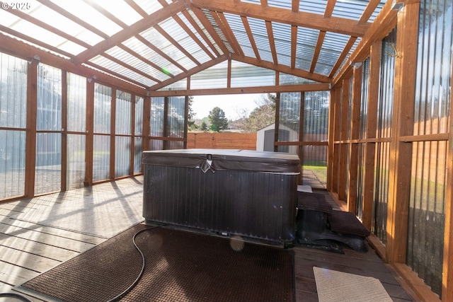 sunroom / solarium featuring lofted ceiling