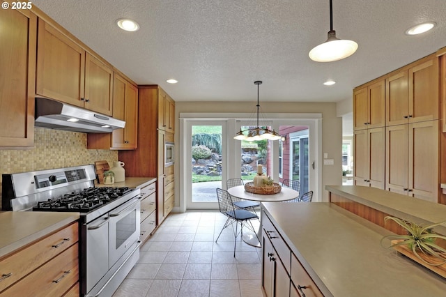 10455 NW Laidlaw Rd, Portland, OR 97229 - kitchen with appliances with stainless steel finishes, under cabinet range hood, a textured ceiling, tasteful backsplash, and recessed lighting