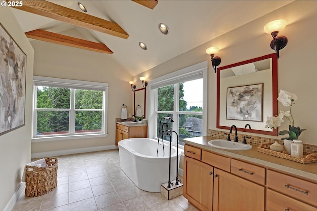 10455 NW Laidlaw Rd, Portland, OR 97229 - bathroom featuring plenty of natural light, a freestanding tub, two vanities, recessed lighting, and tile patterned flooring