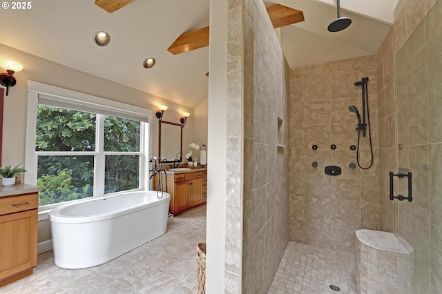 10455 NW Laidlaw Rd, Portland, OR 97229 - full bath featuring vaulted ceiling, vanity, tiled shower, a soaking tub, and tile patterned floors